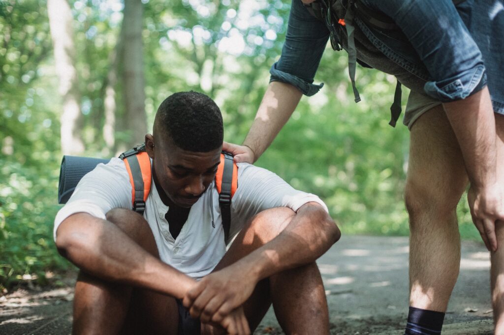 Man helping other man